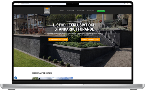 Laptop som visar Betongexpertens webbplats med betongmur och trädgårdsmiljö.